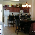 Dining area, bar with stool, and fully equipped kitchen - Ocean Villa 2302