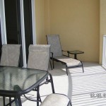 Balcony includes tables and chairs for relaxing - Ocean Villa 505